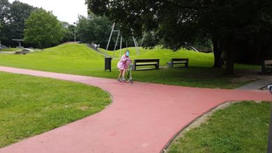 a person riding a scooter on a path