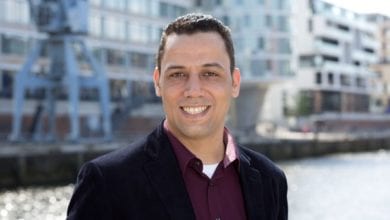 a man smiling at the camera