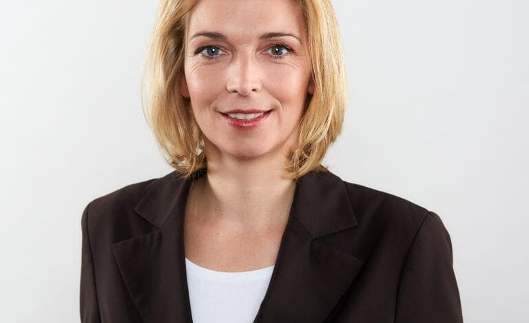 a woman in a black suit
