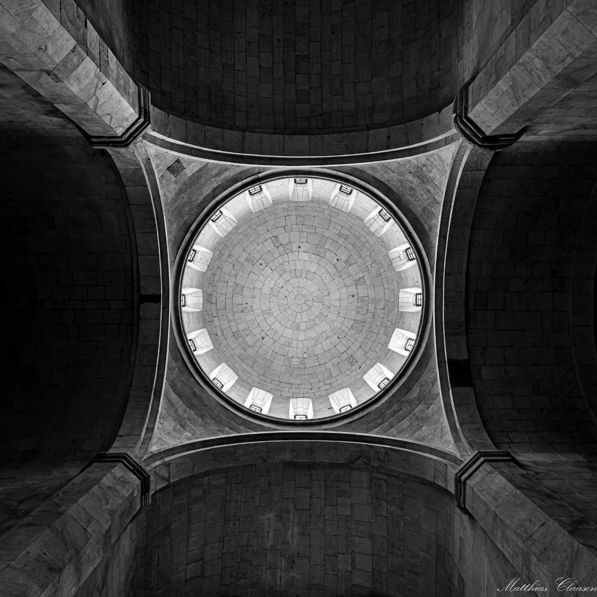 a circular skylight in a stone building