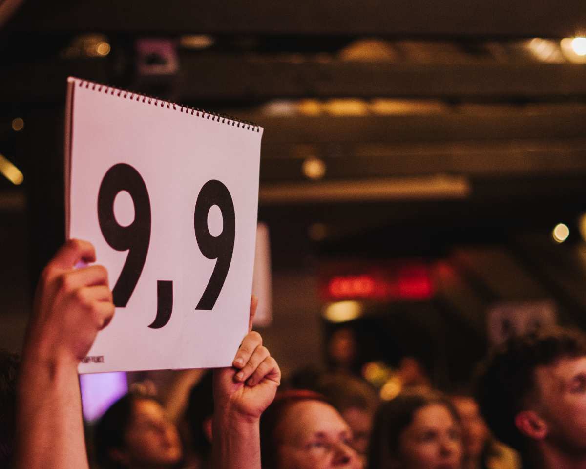 a group of people holding up a sign