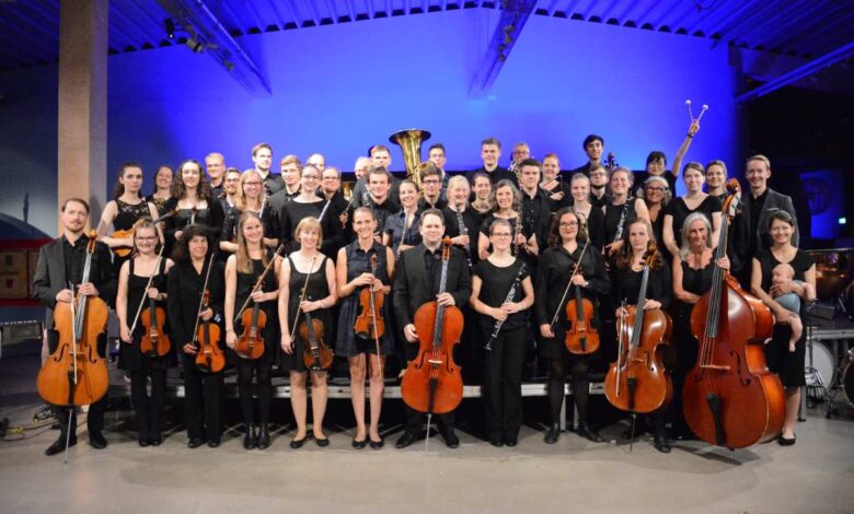 a group of people holding instruments