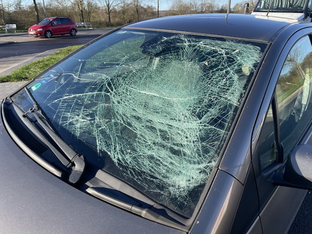 a car with a broken windshield