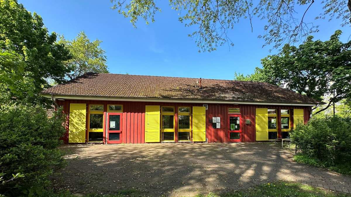 a building with yellow and red shutters