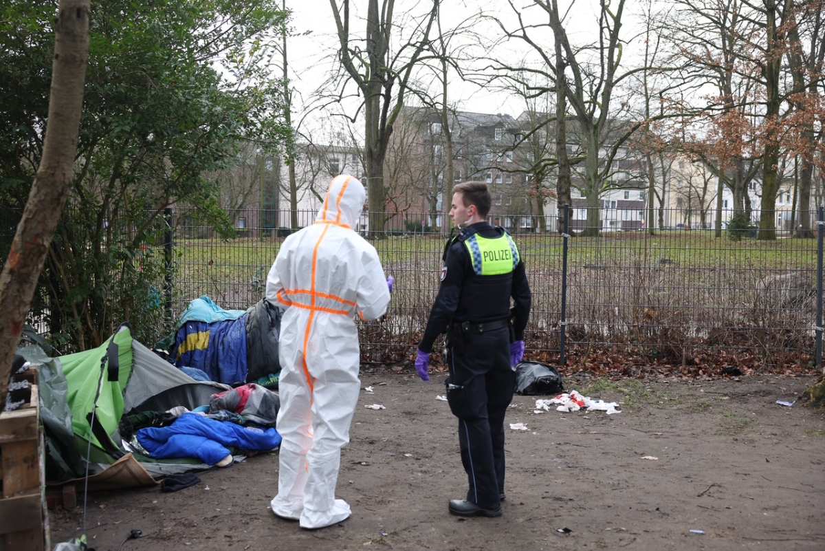 two people in white protective suits