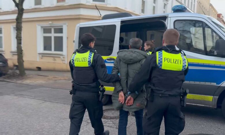 police officers in uniform holding hands to a woman