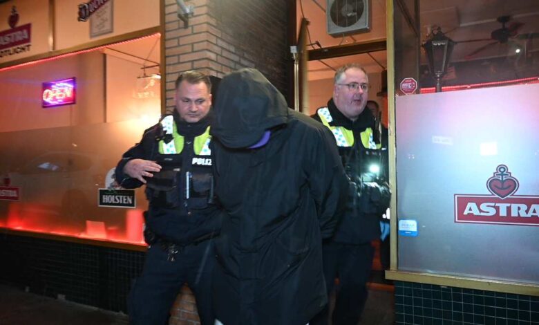 a group of police officers in black jackets