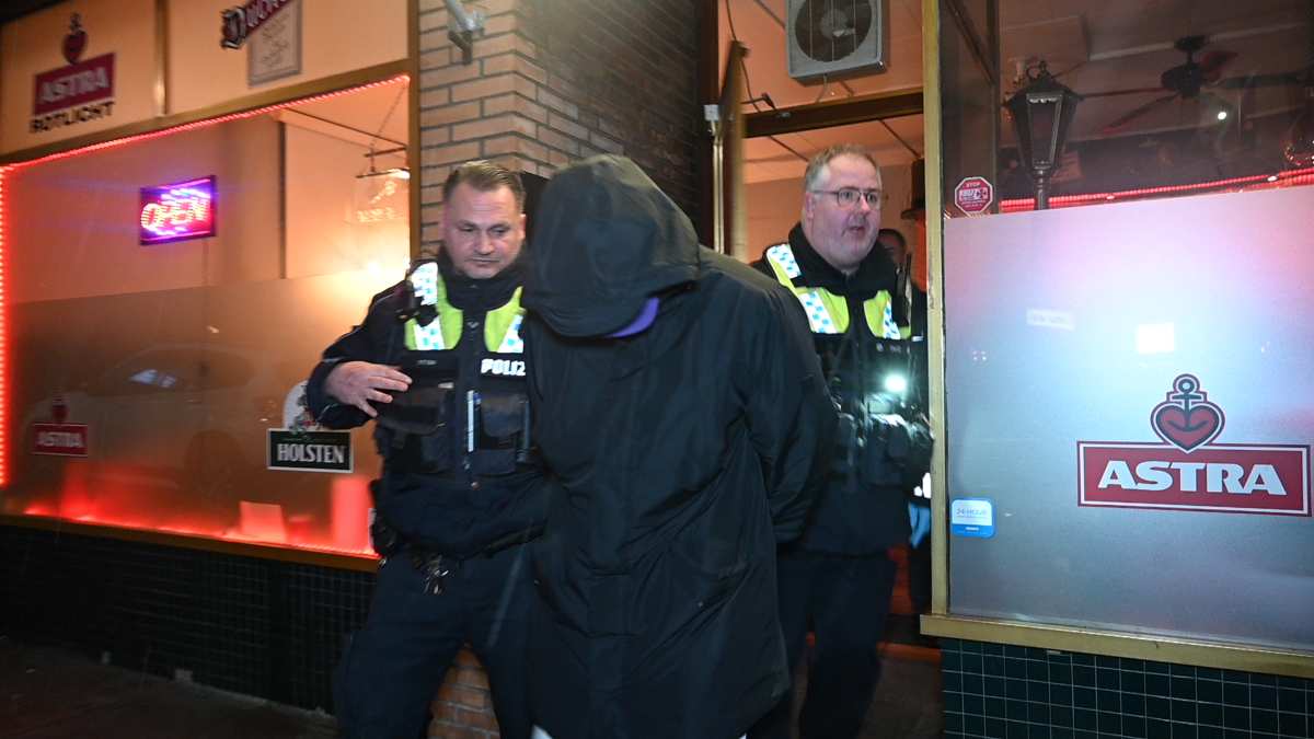 a group of police officers in black jackets