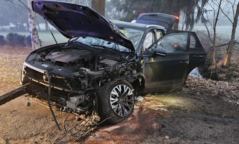 a wrecked car with its hood up