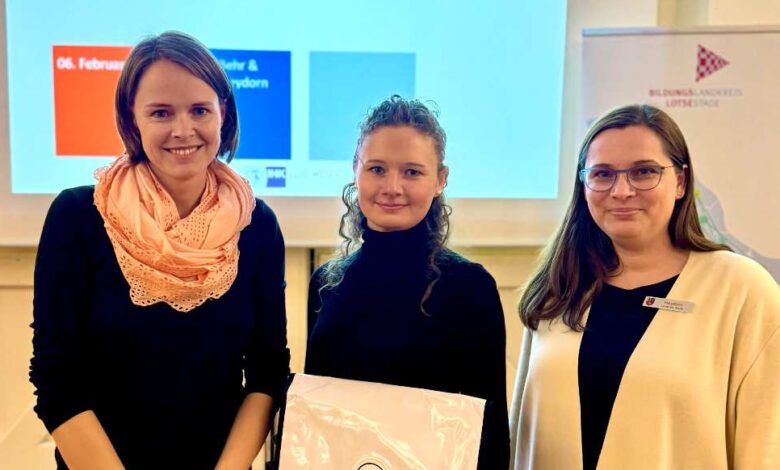 a group of women standing in front of a projector screen