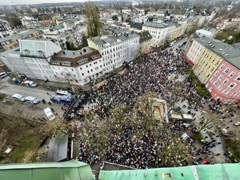 a large crowd of people in a city