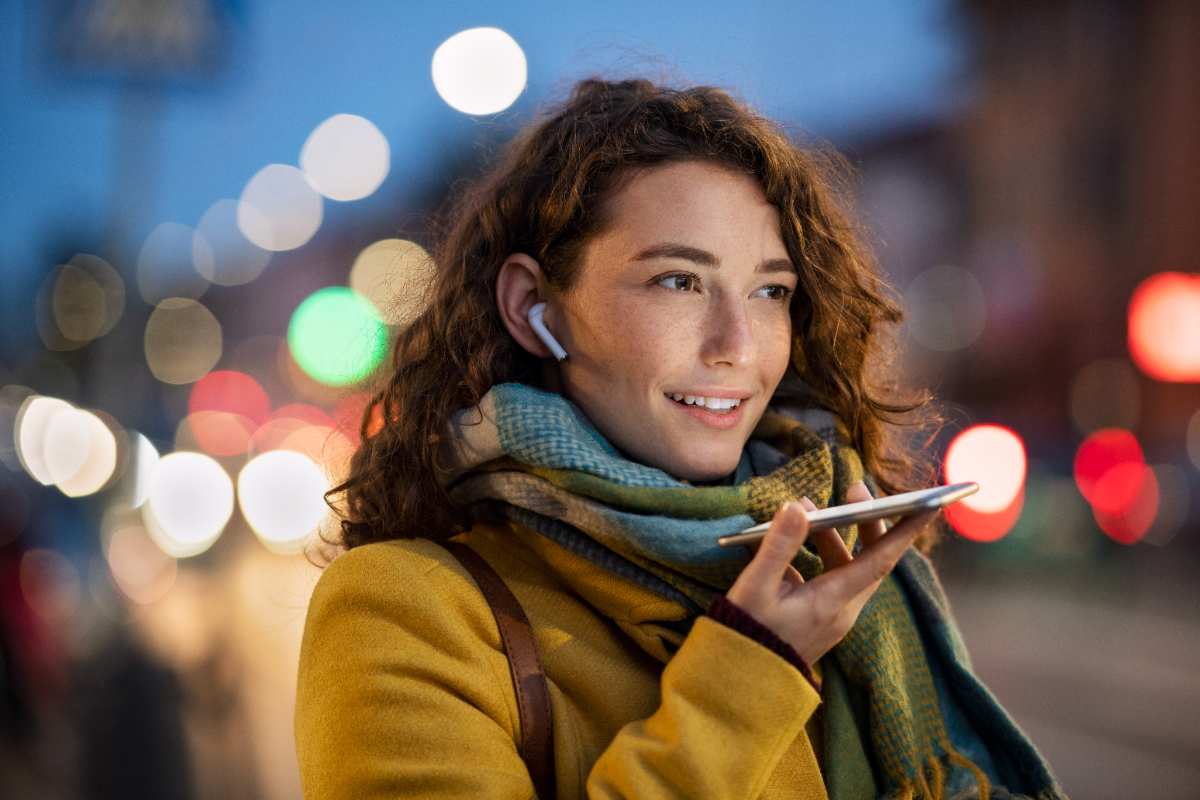 a woman wearing a scarf and a yellow coat