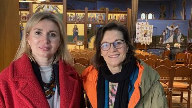 two women standing in a church