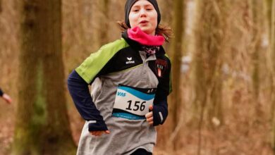 a girl running in a forest