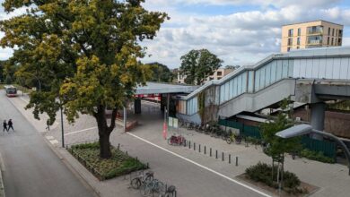 a sidewalk with a staircase and bicycles