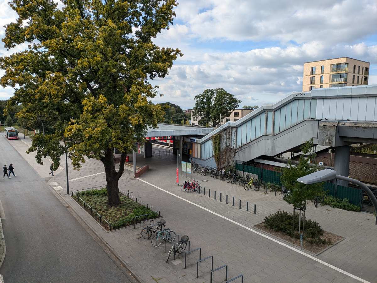 a sidewalk with a staircase and bicycles