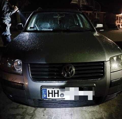 a person standing next to a car