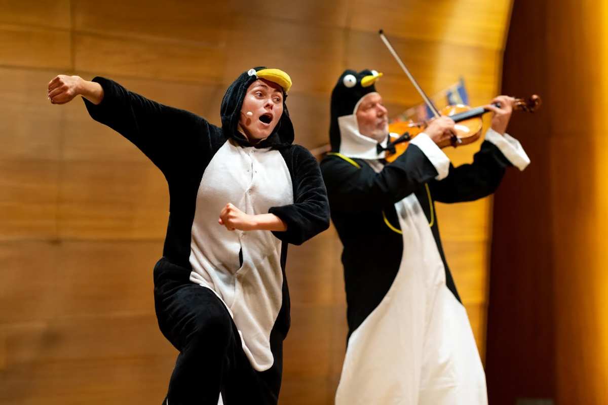 a man and woman in penguin clothing