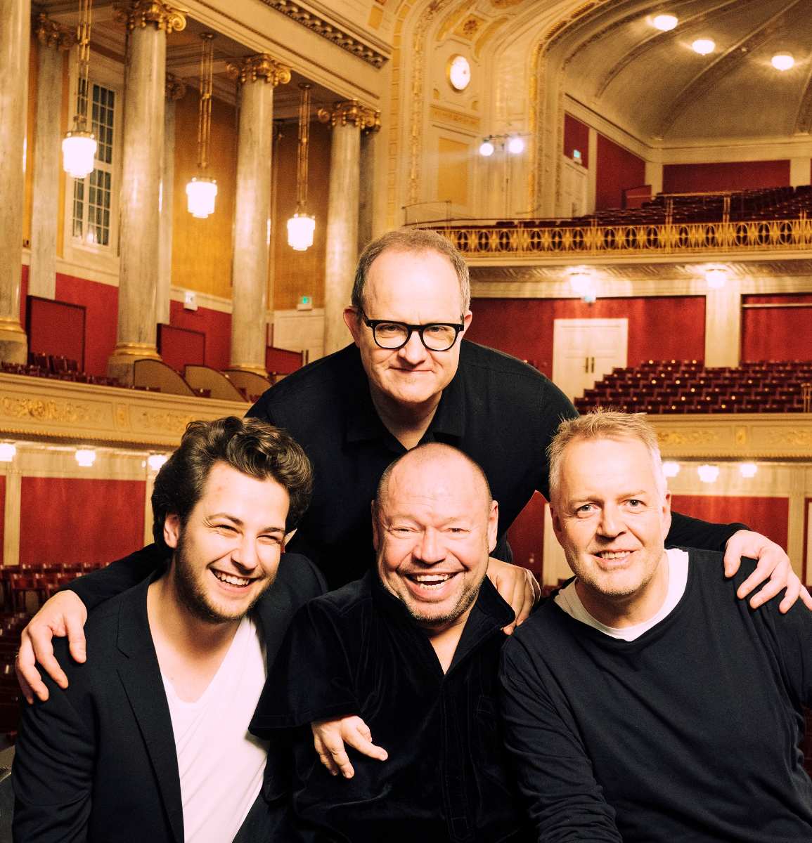 a group of men posing for a photo