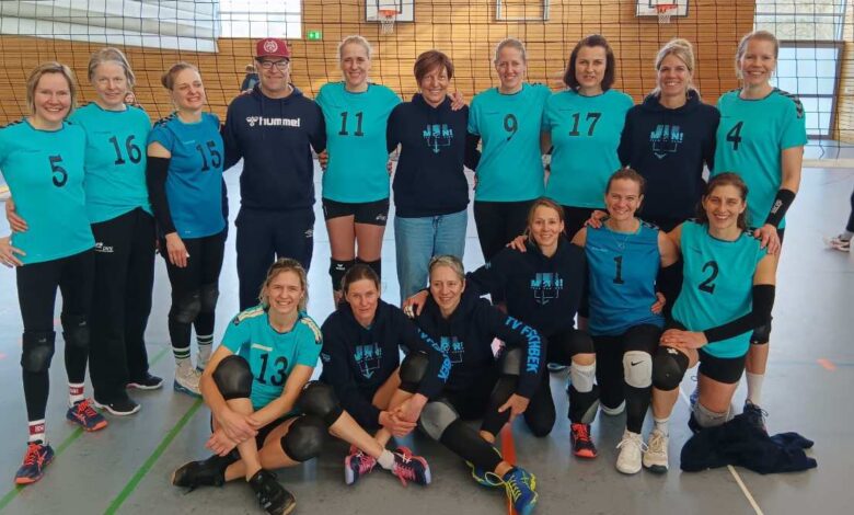 a group of women in blue shirts