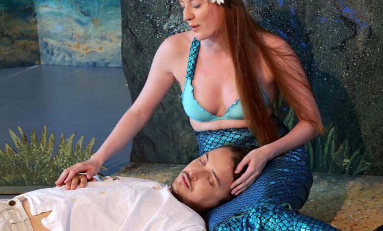 a woman sitting on a man's back