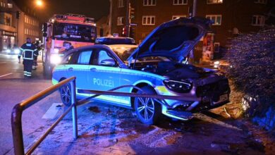 a police car with its hood open