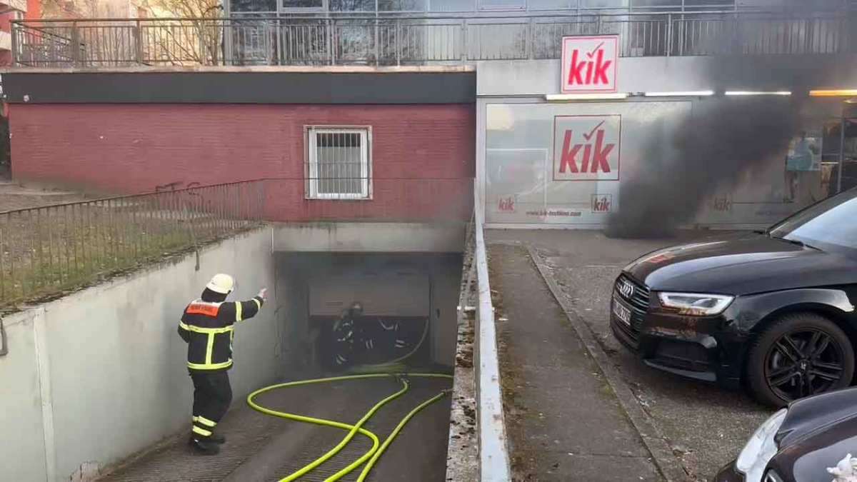 a firefighter in a tunnel with a hose