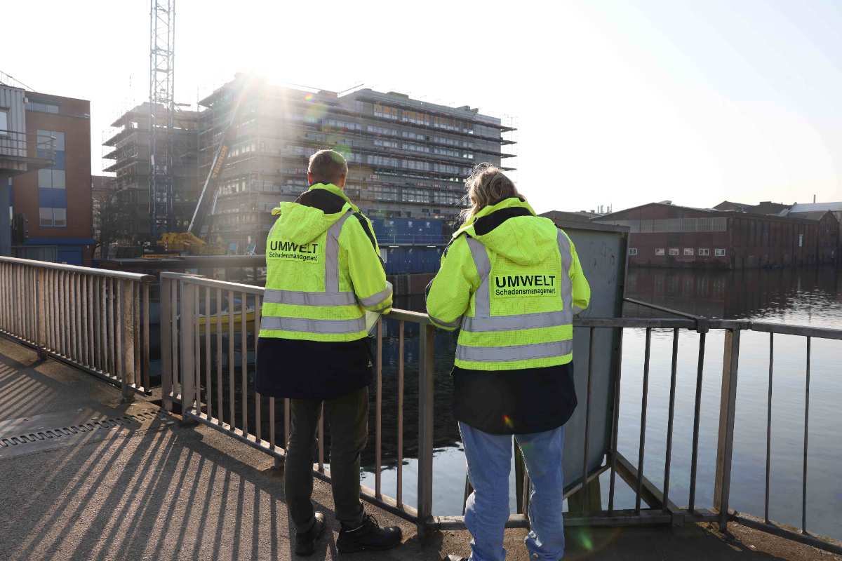 a man and woman wearing reflective jackets