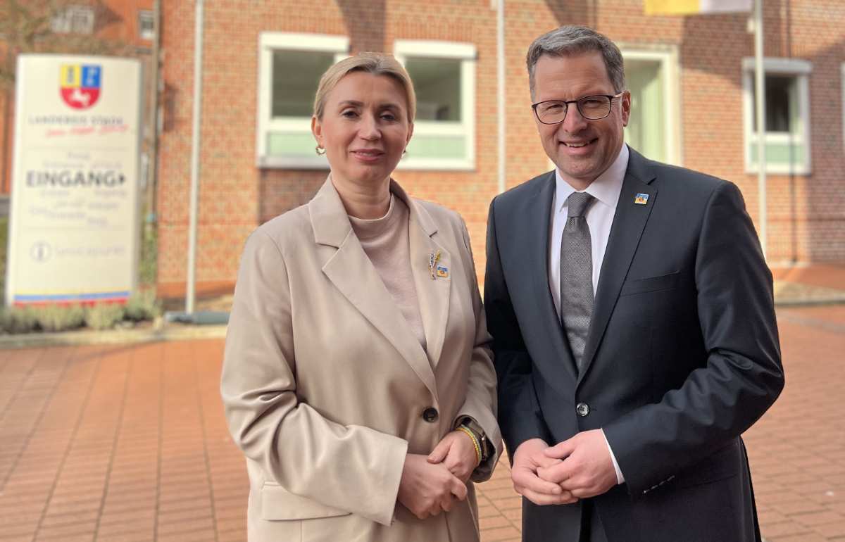 a man and woman standing together