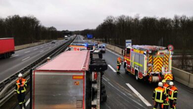 a group of emergency vehicles on a road