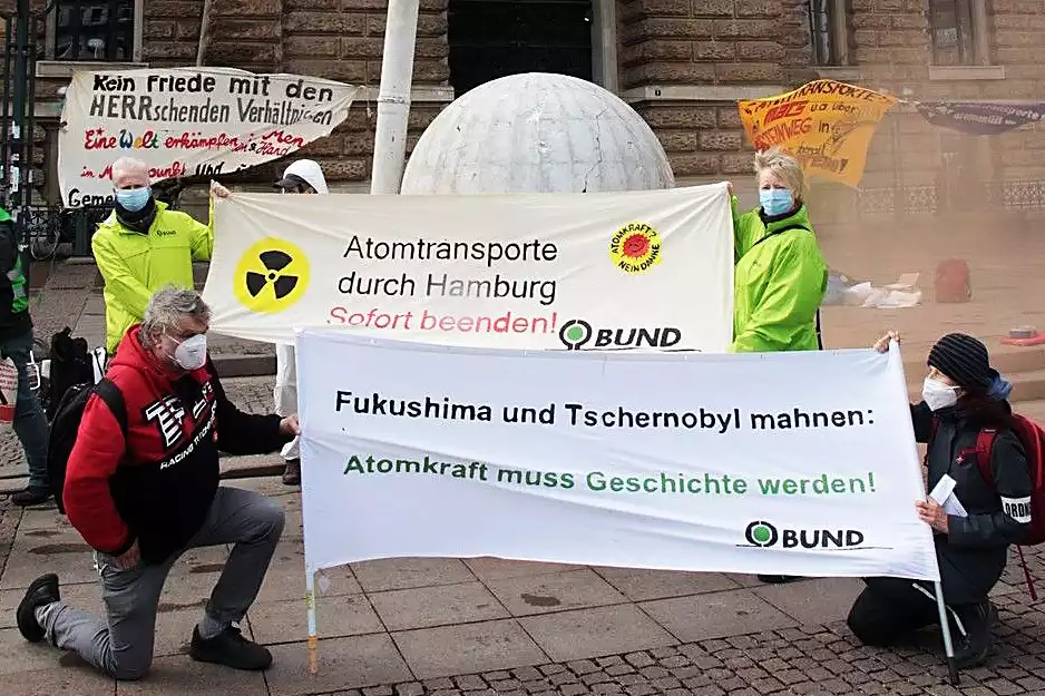 a group of people holding signs