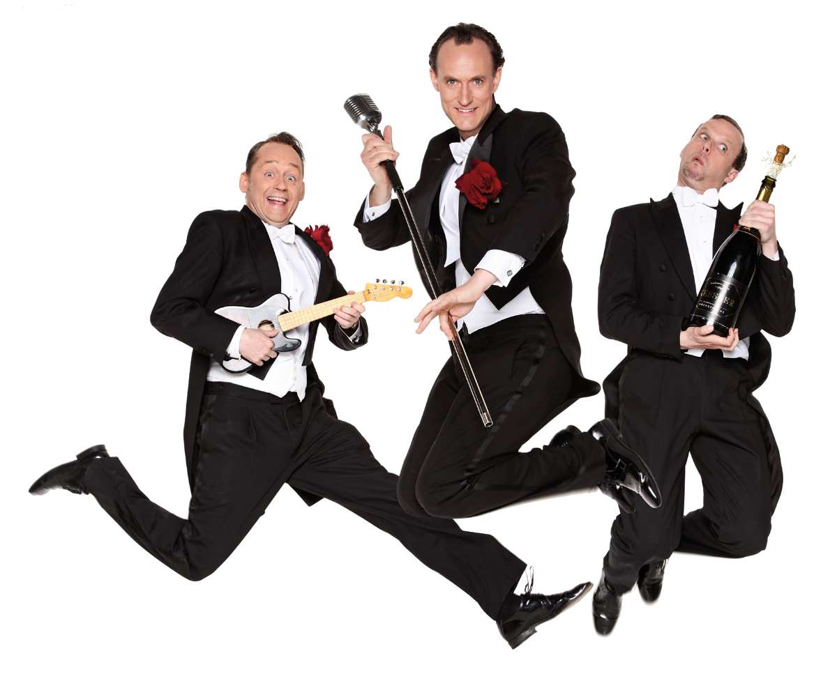 a group of men in suits jumping and holding instruments