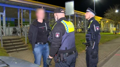 a group of police officers standing outside a building