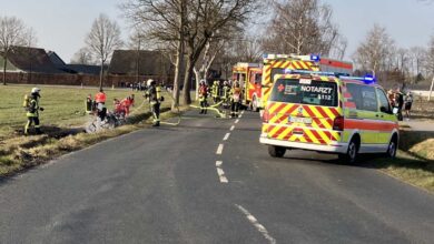 a group of emergency vehicles on a road