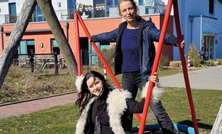two women on a swing
