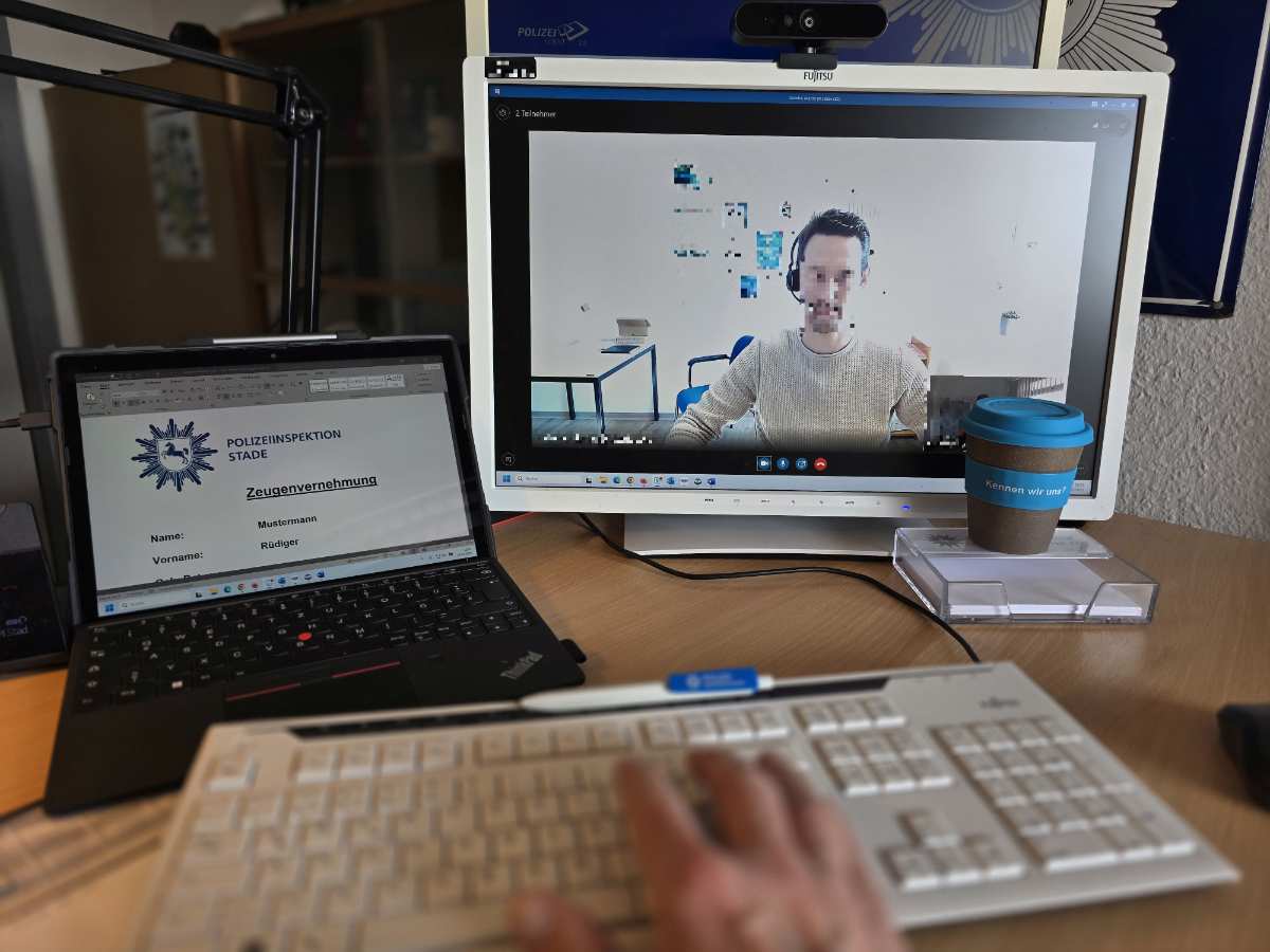 a person using a keyboard and a laptop