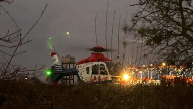 a helicopter parked in the grass