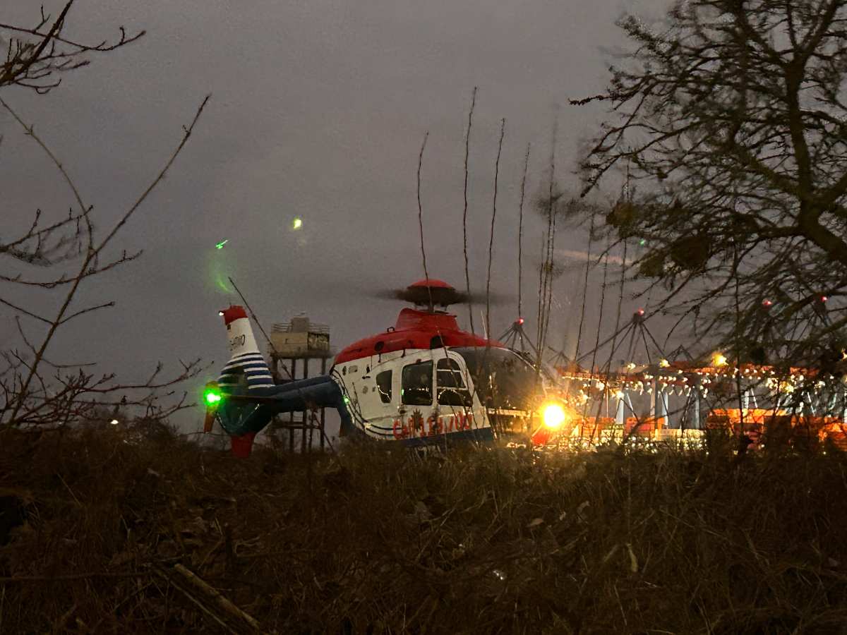 a helicopter parked in the grass