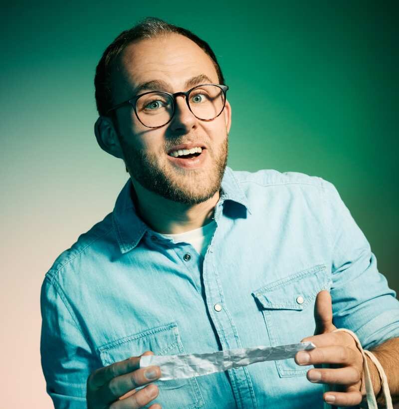 a man holding a piece of paper