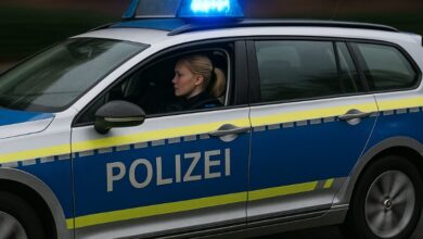 a woman sitting in a police car