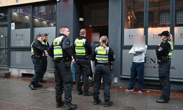 a group of police officers standing outside a building