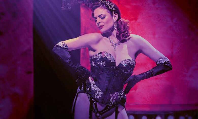 a woman in a burlesque outfit