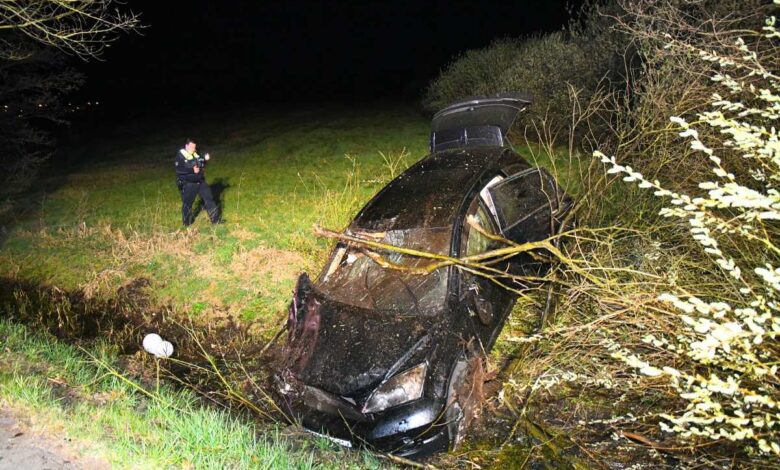 a car crashed into a ditch