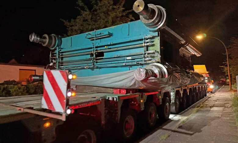 a large blue truck on a street