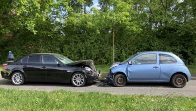 two cars on the side of the road