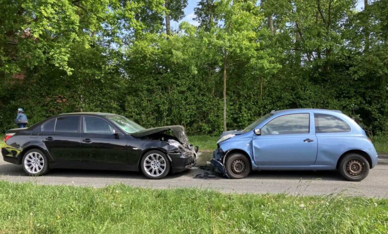 two cars on the side of the road
