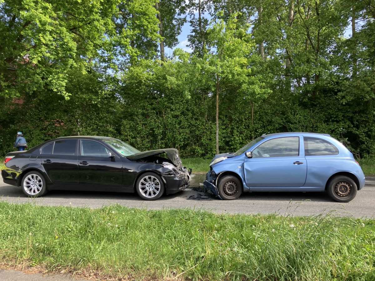 two cars on the side of the road