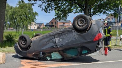 a car that has been crashed on the side of the road