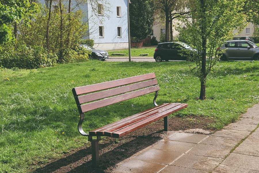 a wooden bench in a park