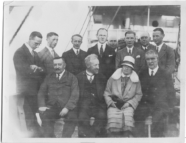 a group of men posing for a photo